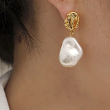 Golden pearl earrings