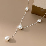 Seafoam pearl necklace with 3mm tassel